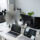 Part of openspace office with group of laptops and computer monitors on workplace of contemporary diversity programmers